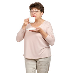 Beautiful woman aged with glasses in hand a cup and saucer tea coffee on white background. Isolation