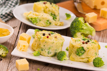 Potato gratins with broccoli florets.