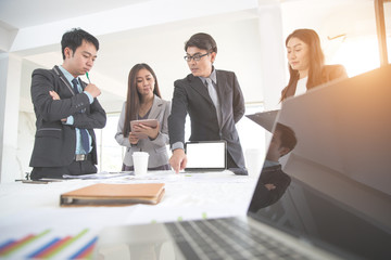 businesspeople meeting and discussing with graph and chart and showing successful result using as background (concept of successful and achievement)