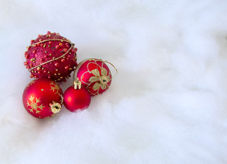 red christmas balls on snow background