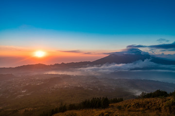 Naklejka na ściany i meble Beautiful landscape view during sunrise from volcano Batur in Bali indonesia