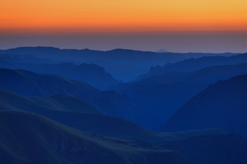 Early morning in the mountain area. Dawn over the mountains and valleys of the North Caucasus in Russia.