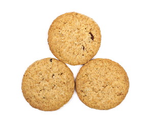 Round whole wheat biscuits, cookies with raisins isolated on white background, top view