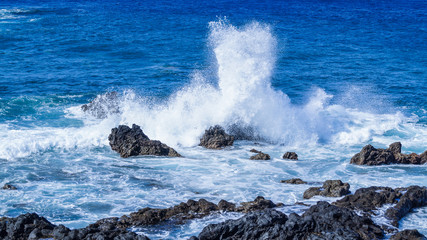 Waves Crashing over Rocks showing Spray and White Foam La Palma Canary Islands Spain