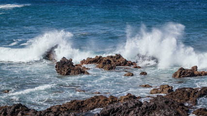 Waves Crashing over Rocks showing Spray and White Foam La Palma Canary Islands Spain