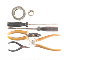 rusty screwdrivers and other old tools on a white background top view