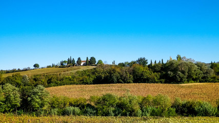 Fototapeta na wymiar Hills, fields and meadows - typical views of Tuscany.