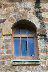 Window in the wall of an old castle.