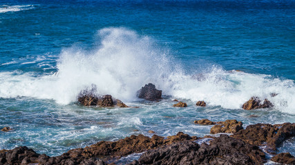 Fototapeta na wymiar Waves Crashing over Rocks showing Spray and White Foam La Palma Canary Islands Spain
