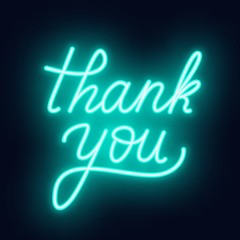 Neon lettering thank you on a dark background.