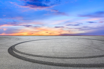 Fototapeta premium Car track square and sky beautiful cloud scenery at sunset