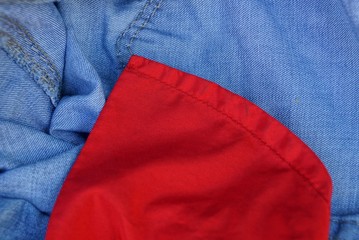 red blue fabric texture of a piece of clothing with a pocket