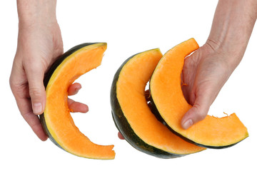 Chef man checks the quality of orange sweet pumpkin vegetable  before cooking. Isolated