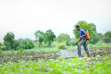 Fototapeta premium farmer spraying pesticides