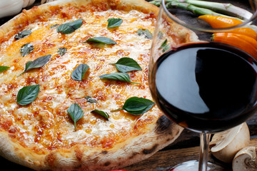 Pizza with glass of red wine