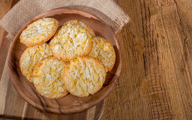 Lemon Crackle Cookies on a Wooden Plate