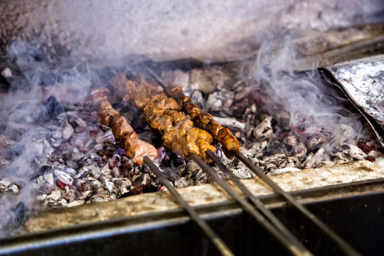 Shish kebab roasting on the barbacue. traditional kusleme kebap.Cooking meat on fire.