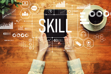 Skill with a person holding a tablet computer - obrazy, fototapety, plakaty