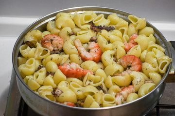 Seafood pasta with clams, prawns. Seafood Cocktail close up.