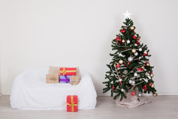 Christmas tree in the room with Christmas decorations and gifts toys