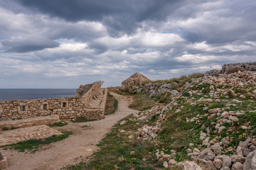Fototapeta na wymiar Fortezza Castle - Venetian fortress on hill Paleokastro in Rethymno.