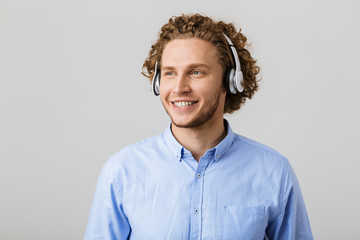 Portrait of a smiling young man with curly hair