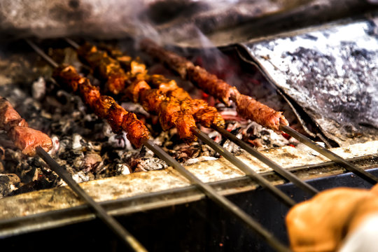 Shish kebab roasting on the barbacue. traditional kusleme kebap.Cooking meat on fire.