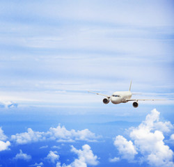 Fototapeta na wymiar airplane in blue sky, travel concept
