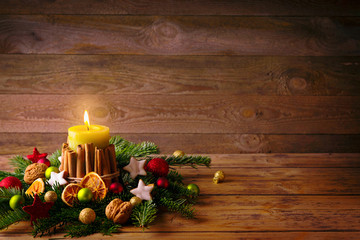 Natural Christmas background with burning candle 