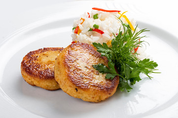 Cutlets from pike on a white plate