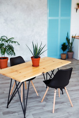 Stylish kitchen interior with dining table and chairs