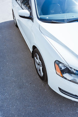 Fototapeta na wymiar cropped image of new white car on street