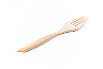 Only empty fork made of wood on white background. Top view. Isolated. Wooden.