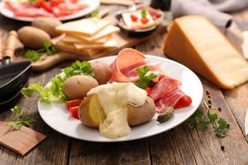 raclette cheese with meat and potato