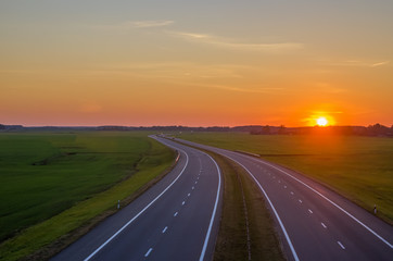 Naklejka premium Highway, sunset, top view