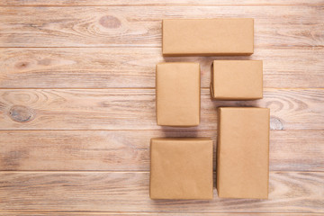cardboard box on white wooden background, Brown mail package top view