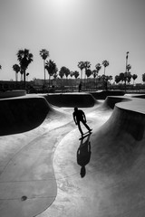 Venice beach skate park with skater silhouette, black and white photo - obrazy, fototapety, plakaty