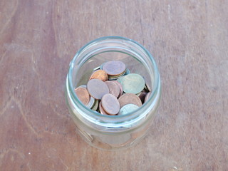 glass jar with money,saving coins concept