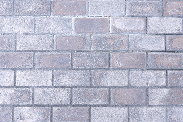 Gray background with pink tones brick wall background. Construction texture pattern