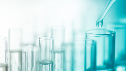 Dropping chemical liquid to test tube, laboratory research and development concept. scientist...