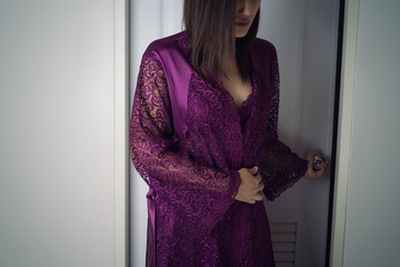 The woman in purple nightdress left the toilet at midnight. Asian people have a Stomach ache,...