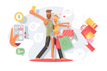 Couple taking selfie with shopping bags.