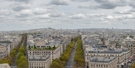 Aerial View of Downtown Paris Facing  the Sacre-Cœur Church with Cloudy Skies