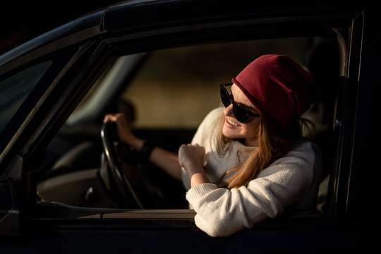 Hipster woman driving a car