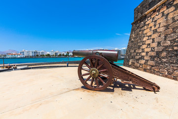 Fototapeta na wymiar Old cannons in front of the Castillo de San Gabriel Castle, Arrecife, Lanzarote, Canary Islands, Spain