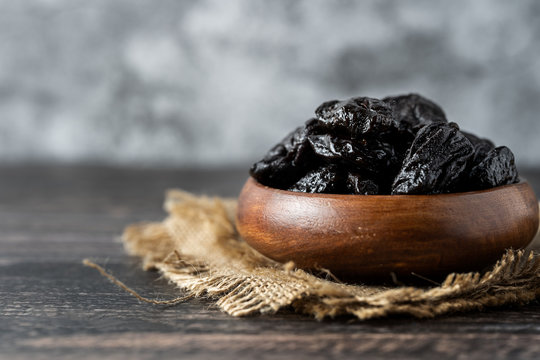 Prune In Wooden Bowl