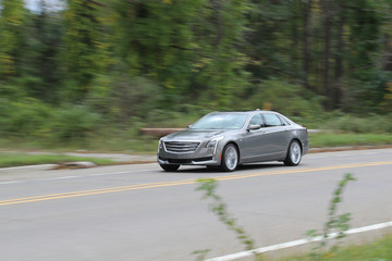 Luxury Sedan Traveling Down The Road