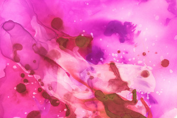 beautiful violet and red splashes of alcohol inks as abstract background