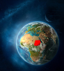 Sudan from space on Earth surrounded by space with Moon and Milky Way. Detailed planet surface with city lights and clouds.