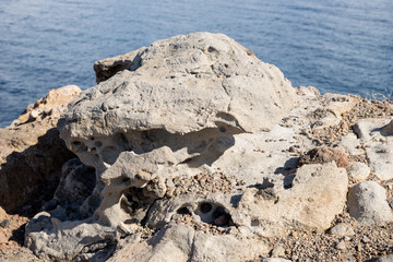 Closeup of a big stone with holes